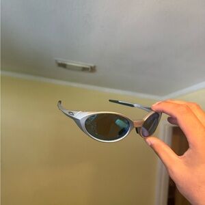 Silver Oval Sunglasses with Blue Lenses Oakley Oakleys